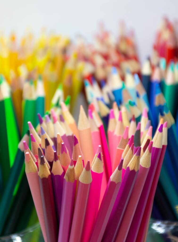 Close-up of vibrant colored pencils arranged in a vertical shot. Ideal for art and design themes.